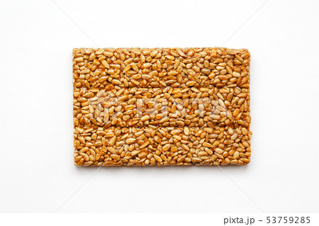 A large golden tile of sunflower seeds, a bar in a 53759285
