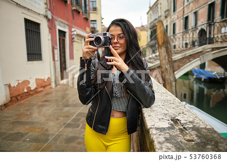 Travel photographer woman with camera in Venice, 53760368