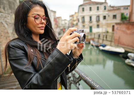 Travel photographer woman with camera in Venice, 53760371