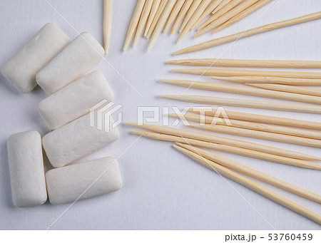 Toothpicks and chewing gum on white background Toothpicks and chewing gum on white background 53760459