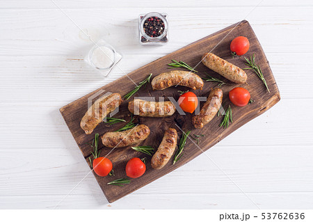 Grilled sausages with tomatoes , pepper and Grilled sausages with tomatoes , pepper and 53762636