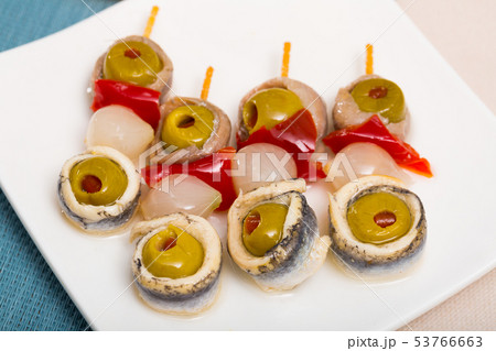 Appetizers with anchovies and vegetables 53766663