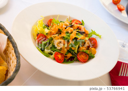 Plate of delicious salad with seafood 53766941