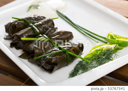 Tasty grape rolls made from grape leaves, dish of Bulgarian cuisine 53767341