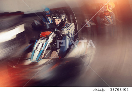 Young people driving sport cars for karting 53768402