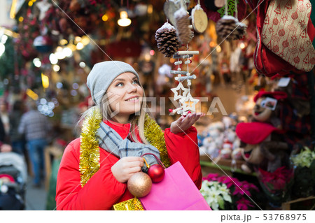 Woman shopping on Christmas market Woman shopping on Christmas market 53768975