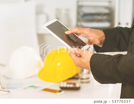 Hands of businessman using smartphone 53770337