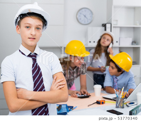 Teen boy in color helmet builder 53770340