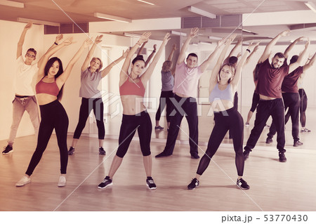 adults of different ages dancing at dance class 53770430