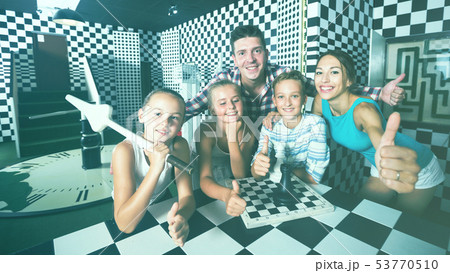 Parents with their children are satisfied after visit of escape room Parents with their children are satisfied after visit of escape room 53770510