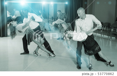Couples enjoying latin dances 53770862