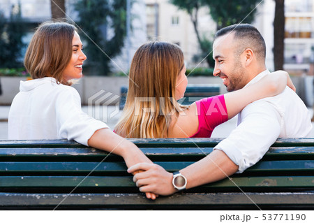 Image of the love triangle between young people outdoor. 53771190