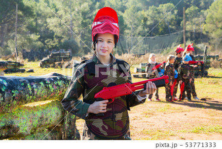 girl paintball player in camouflage standing 53771333
