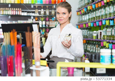 Salesgirl at workplace in perfume shop 53771334
