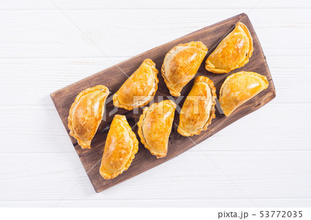 Latin American baked beef empanadas with sauce 53772035