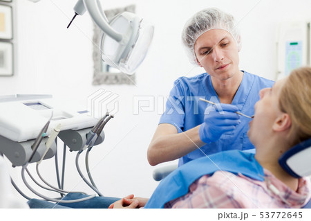 Young woman on dental checkup in modern dentist office Young woman on dental checkup in modern dentist office 53772645