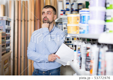 Glad man designer is choosing paint with list Glad man designer is choosing paint with list 53772976