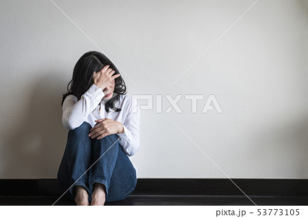 Stressful woman sitting sadly emotional depression 53773105