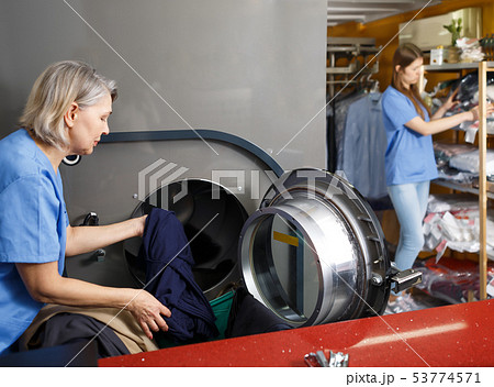 Two female laundry employees working 53774571