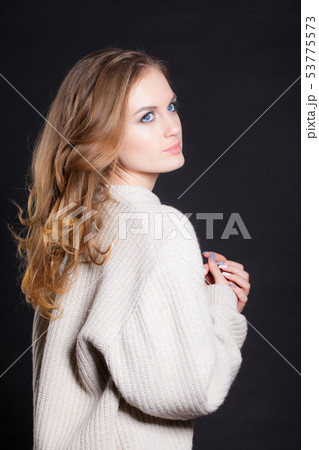 Portrait of a beautiful woman in a big sweater 53775573