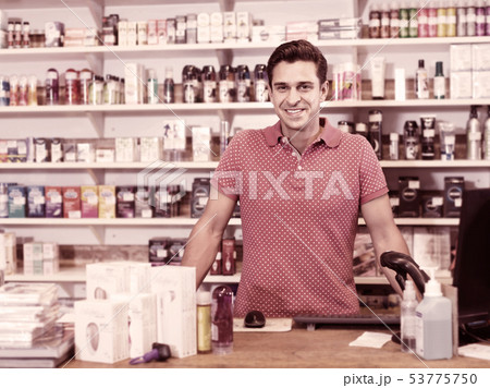 Male selling different sexy toys and goods in the sex shop 53775750