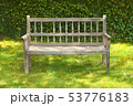 Ancient wooden bench in a garden 53776183