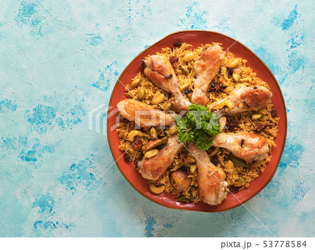 Homemade chicken Biryani on a blue background.  53778584