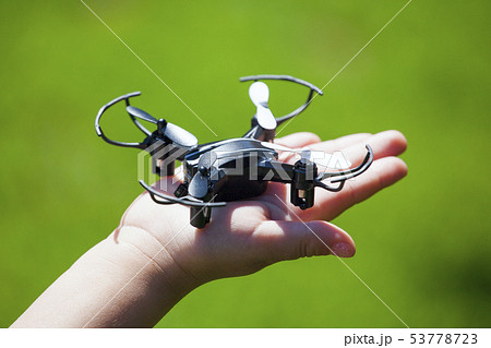 quadcopter children hand grass background quadcopter children hand grass background 53778723