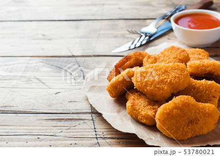 chicken nuggets with tomato sauce on wooden chicken nuggets with tomato sauce on wooden 53780021
