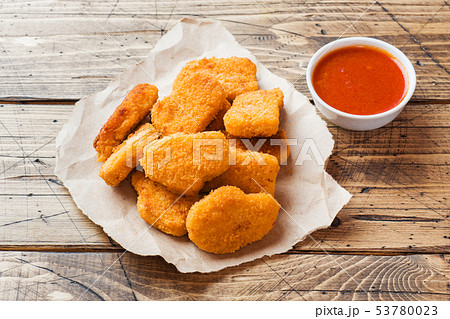 chicken nuggets with tomato sauce on wooden chicken nuggets with tomato sauce on wooden 53780023