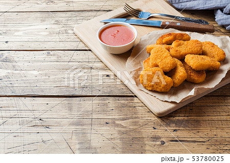 chicken nuggets with tomato sauce on wooden chicken nuggets with tomato sauce on wooden 53780025