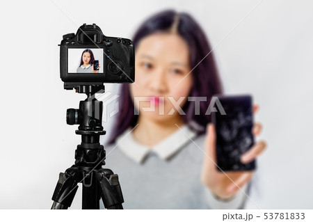 Focus on live view on camera on tripod, teenage Focus on live view on camera on tripod, teenage 53781833
