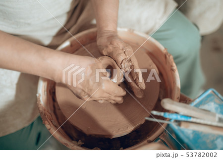 Top view of male hands with clay in potter's studio 53782002