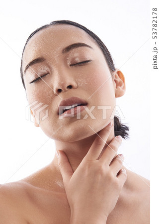 Sensual photo of Asian young woman touching her neck 53782178
