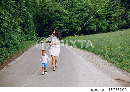 Mother with son playing in a summer park 53783205
