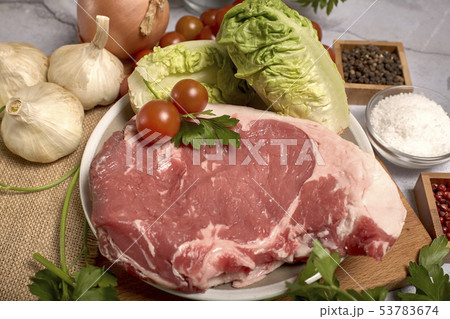 red veal chop on a plate 53783674