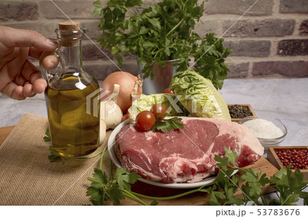 red veal chop on a plate 53783676