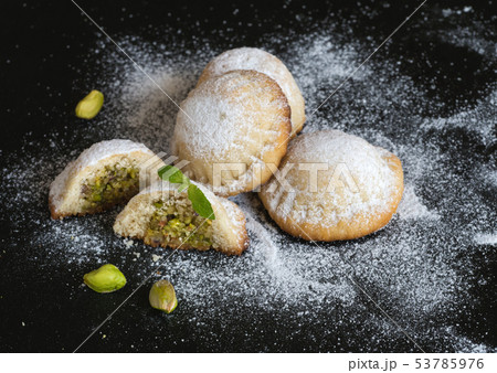 Holiday cookies stuffed with pistachios with honey 53785976