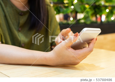 Hand of woman using smart phone. Online shopping Hand of woman using smart phone. Online shopping 53788486