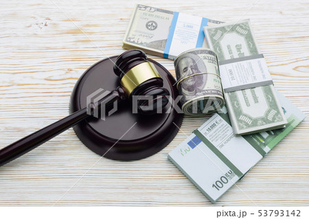 Top view Judge's gavel and packs of dollars and 53793142