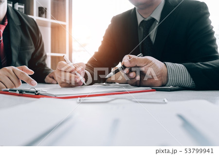 Business people analyzing investment graph meeting Business people analyzing investment graph meeting 53799941