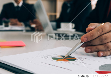 Business people analyzing investment graph meeting Business people analyzing investment graph meeting 53799972