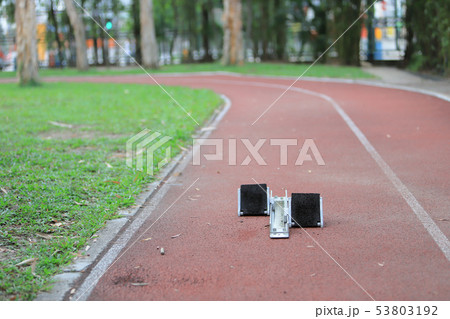 Athletics Starting Blocks and red running tracks Athletics Starting Blocks and red running tracks 53803192