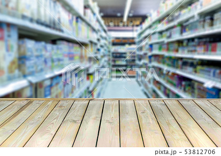 Wooden board with empty table blurred shopping mall background. Wooden board with empty table blurred shopping mall background. 53812706