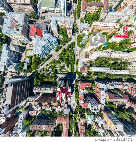 Aerial city view with roads, houses and buildings. Aerial city view with roads, houses and buildings. 53813475
