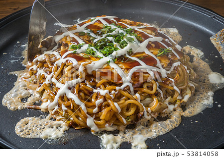 お好み焼き Okonomiyaki is a Japanese-style pancake お好み焼き Okonomiyaki is a Japanese-style pancake 53814058