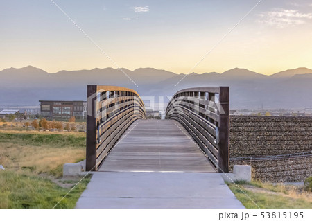 Bridge in Oquirrh Lake with sunset in the horizon Bridge in Oquirrh Lake with sunset in the horizon 53815195