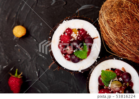 Fruit salad agrus gooseberry, rasbberry in coconut 53816224