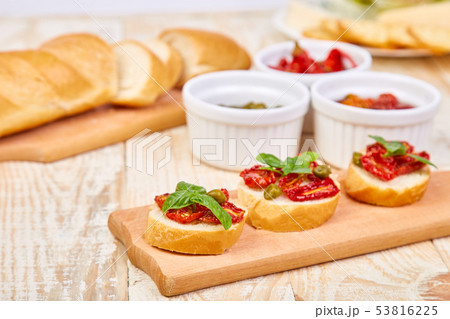 Bruschetta or crostini with sun dried tomatoes  53816225