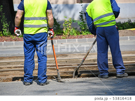 Men are working at the road construction 53816418